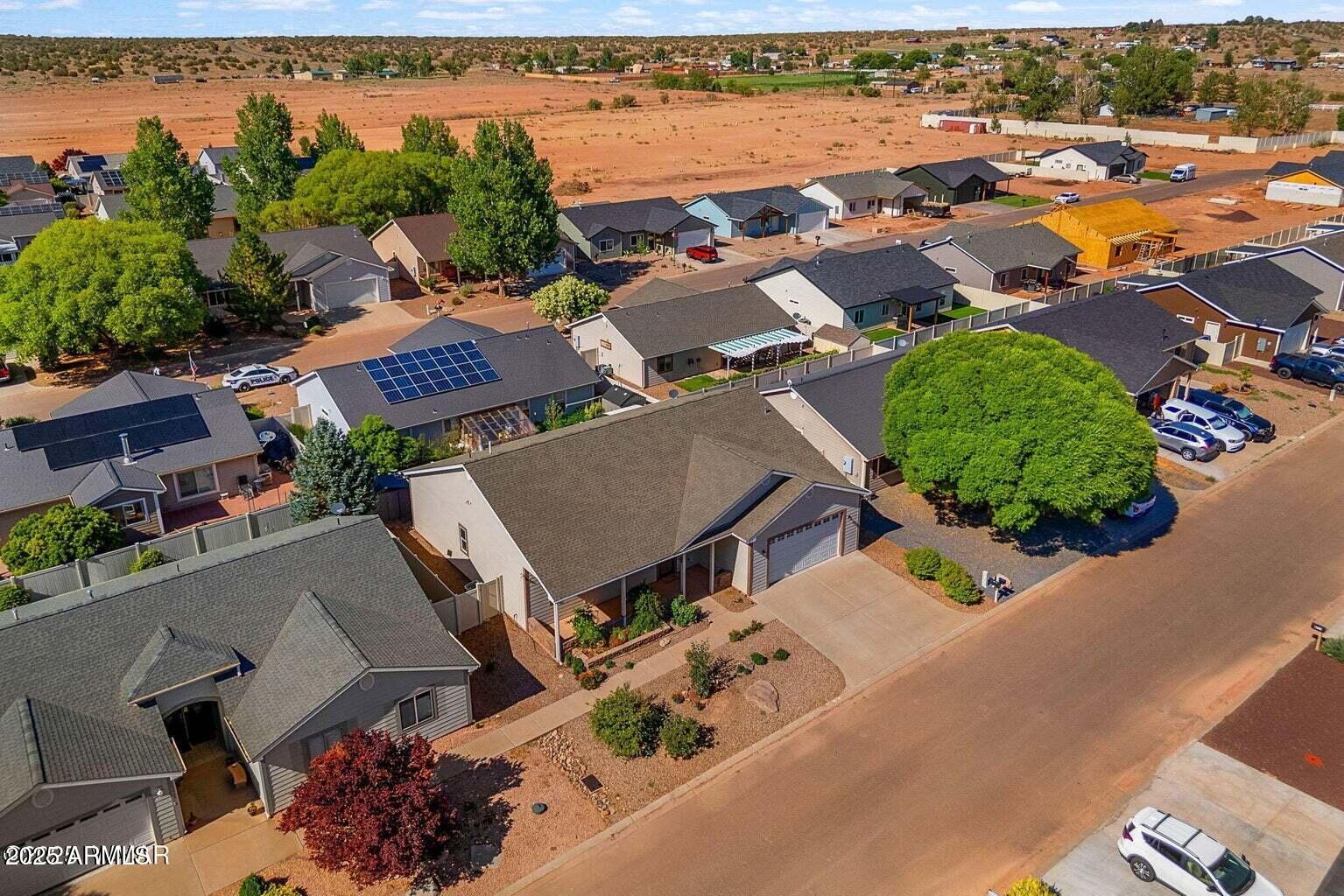 1058 East Adams Street Snowflake, AZ 85937 - Photo 26 of 36 an aerial view of a house with a garden and lake view