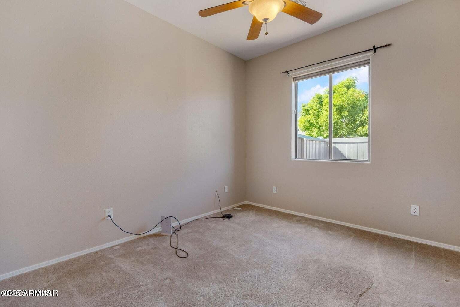 1058 East Adams Street Snowflake, AZ 85937 - Photo 27 of 36 an empty room with a window