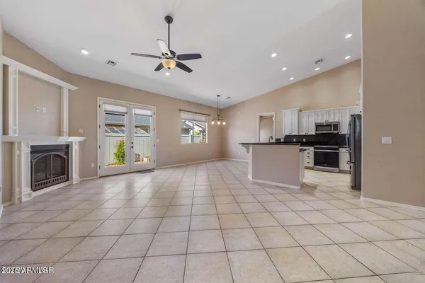 a view of a kitchen with microwave and cabinets