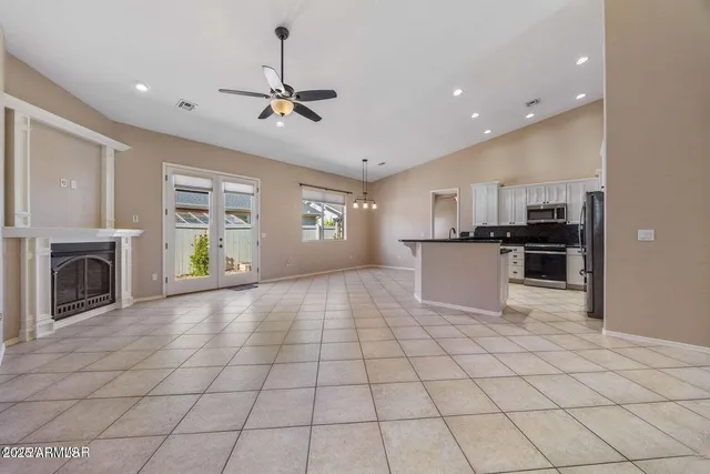a view of a kitchen with microwave and cabinets
