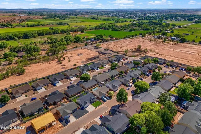 a view of a house with a small yard and plants