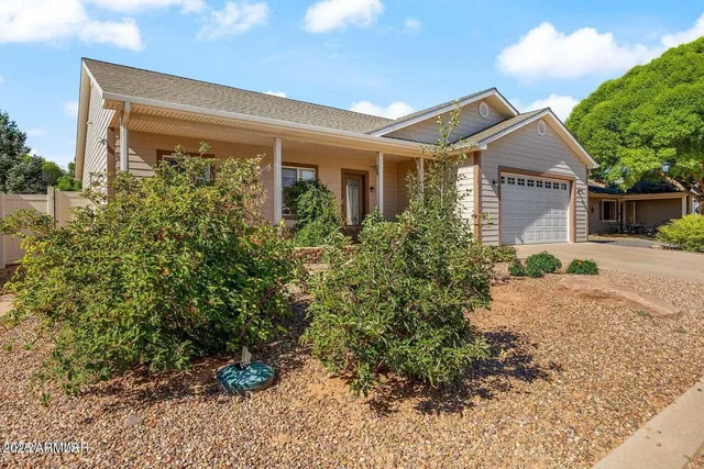 a view of a back yard from a balcony