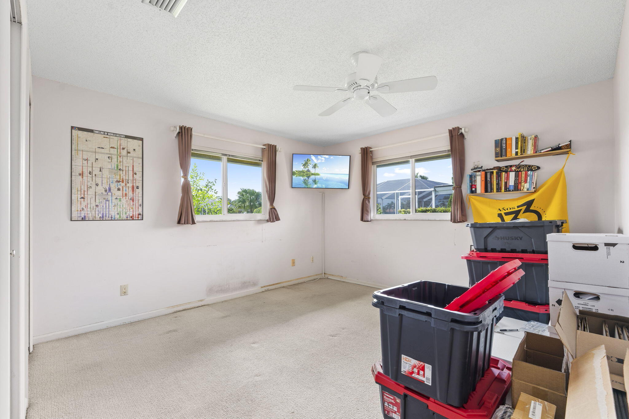 3374 Southeast Fairway East Stuart, FL 34997 - Photo 27 of 65 a room with furniture and painting on the wall