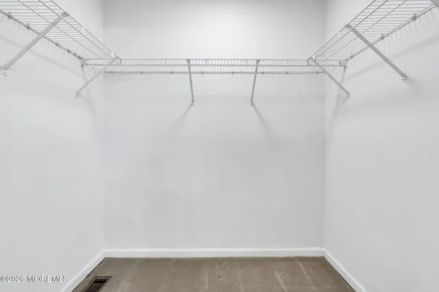 a view of a house with swimming pool and sitting area