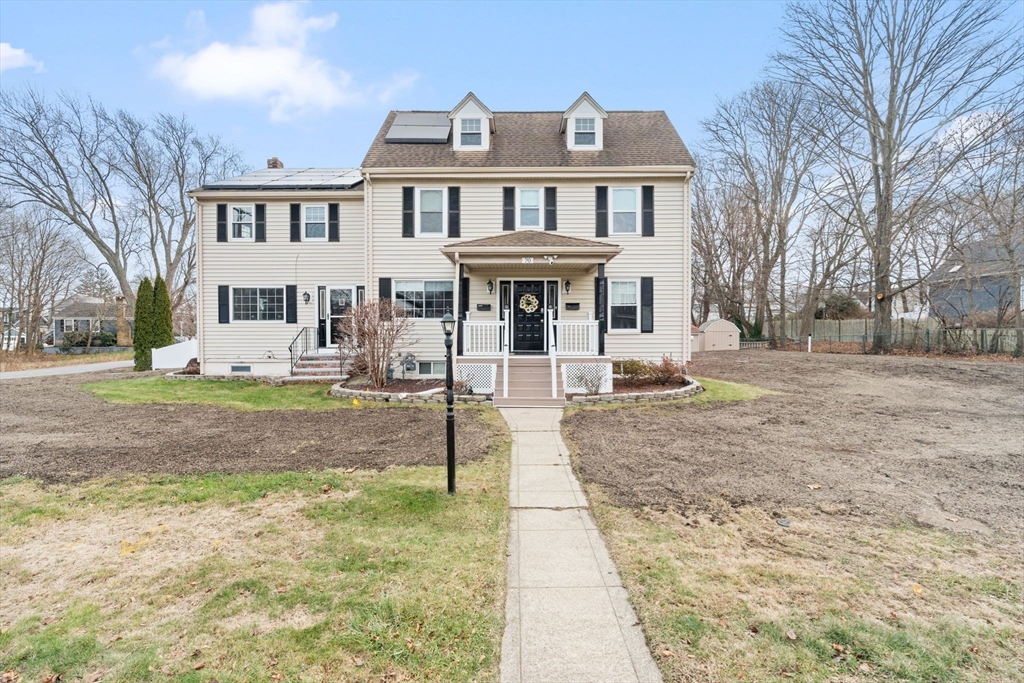 70 West High Street, Unit 2 Avon, MA 02322 - Photo 1 of 22 a front view of a house with a yard