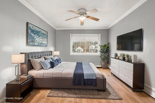 a spacious bedroom with a large bed and a flat screen tv