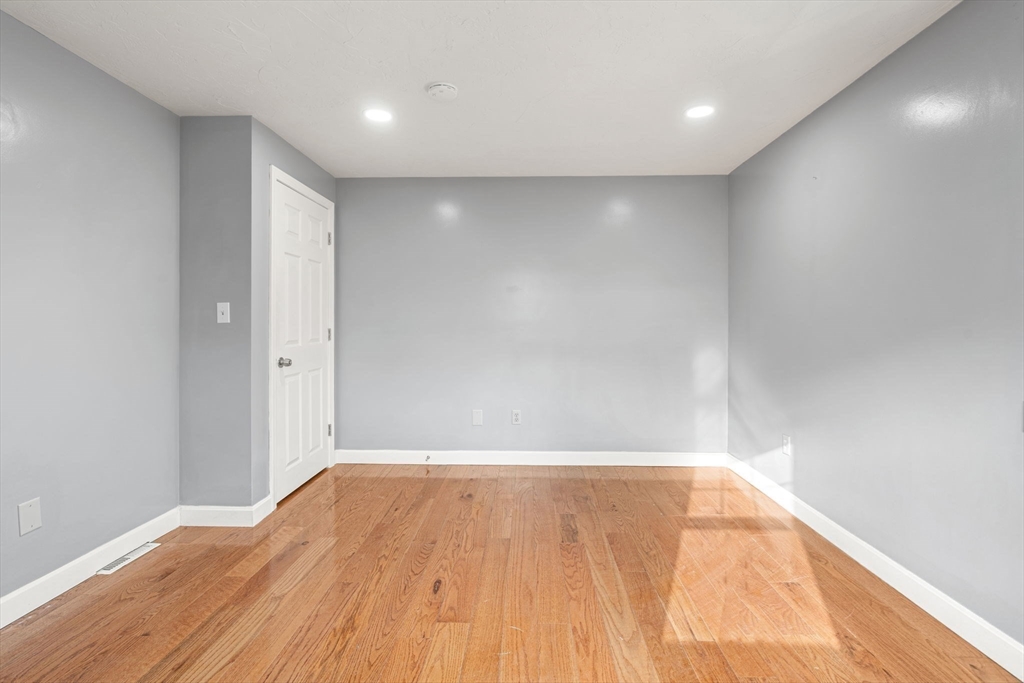 70 West High Street, Unit 2 Avon, MA 02322 - Photo 13 of 22 a view of room with wooden floor