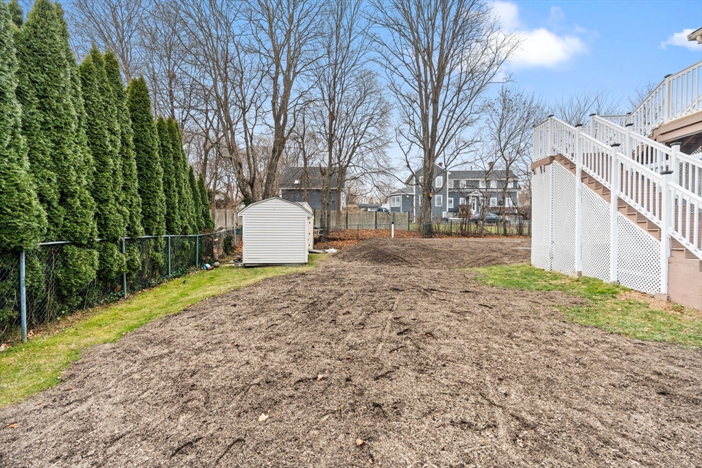 70 West High Street, Unit 2 Avon, MA 02322 - Photo 19 of 22 a view of a backyard with large trees