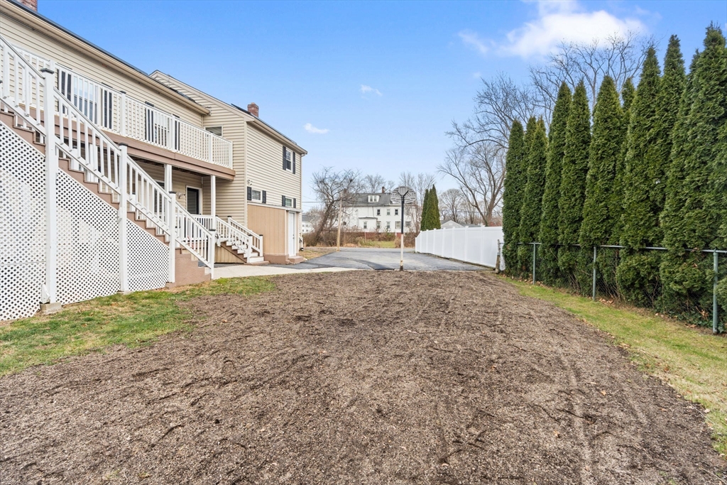 70 West High Street, Unit 2 Avon, MA 02322 - Photo 21 of 22 a view of a house with a yard