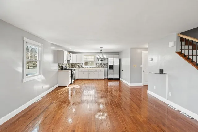 a view of kitchen with wooden floor