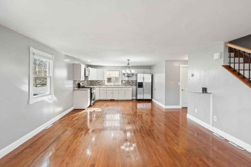 70 West High Street, Unit 2 Avon, MA 02322 - Photo 7 of 22 a view of kitchen with wooden floor