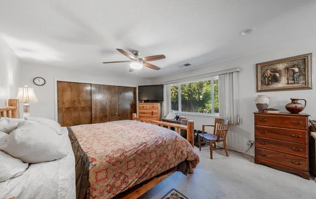 a bed room with a bed and furniture