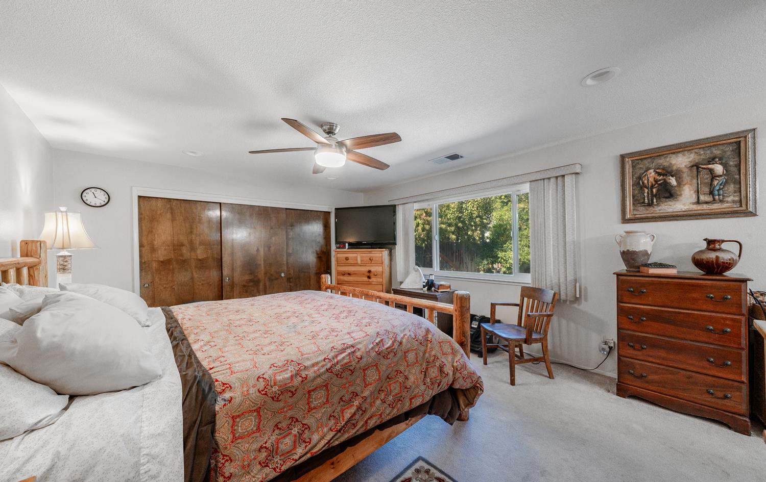 20058 Cardoza Road Los Banos, CA 93635 - Photo 13 of 30 a bed room with a bed and furniture