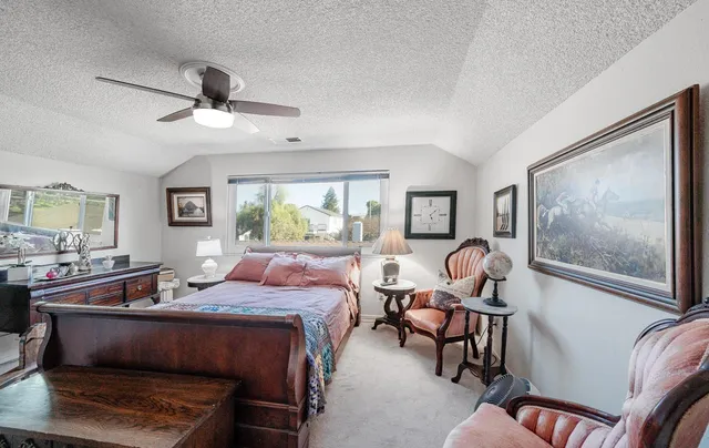a bedroom with furniture and a window