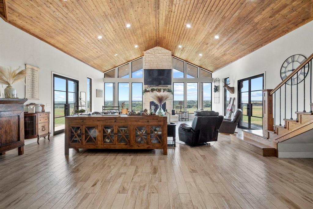 2296 County Road 290 Dublin, TX 76446 - Photo 4 of 40 a living room with a bed furniture and a wooden floor