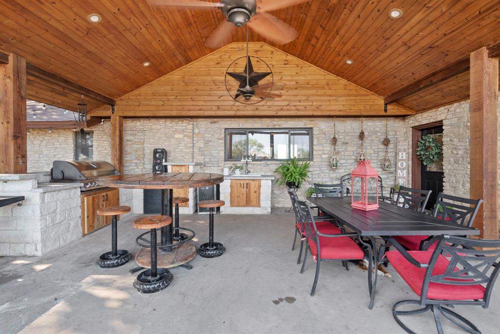 2296 County Road 290 Dublin, TX 76446 - Photo 9 of 40 a view of a dining room with furniture and a chandelier