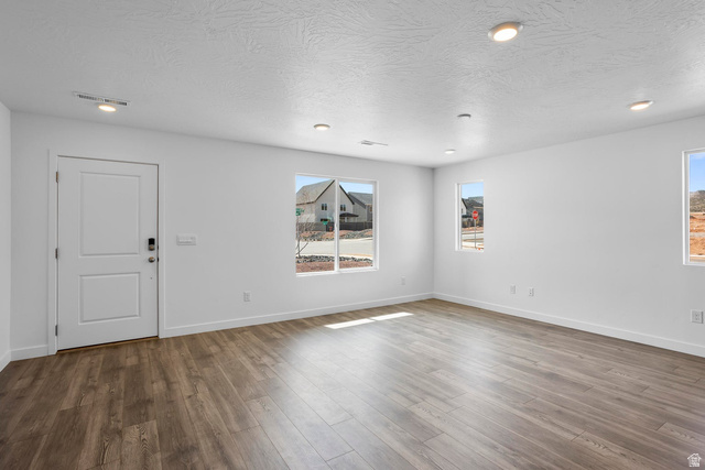 2194 Wolverine Way, Unit 2531 Washington, UT 84780 - Photo 14 of 52 Spacious room featuring wood-finish flooring, white walls, and recessed lighting