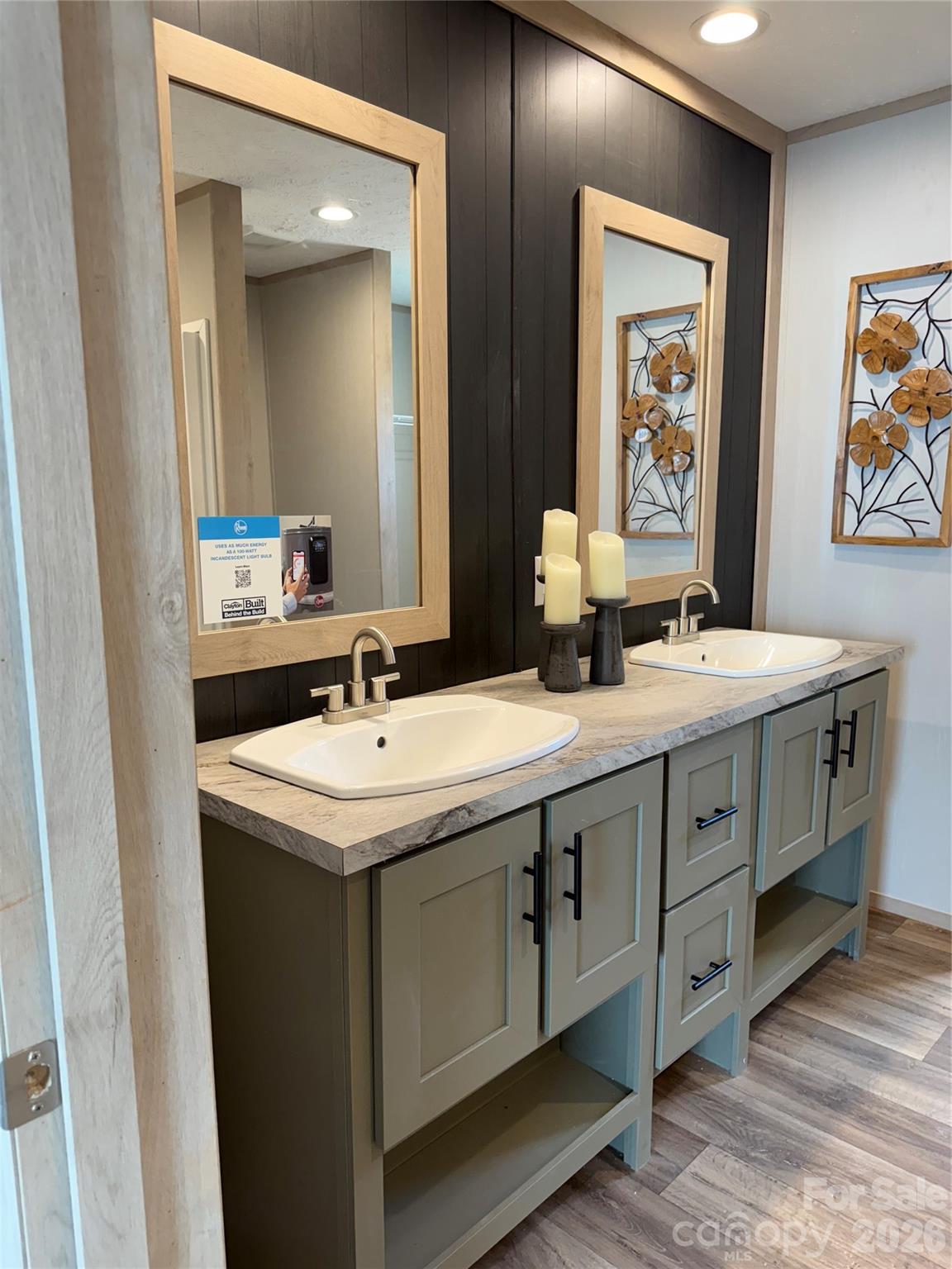 516 Lake Mullis Road Harmony, NC 28634 - Photo 12 of 28 a bathroom with double sink and a mirror