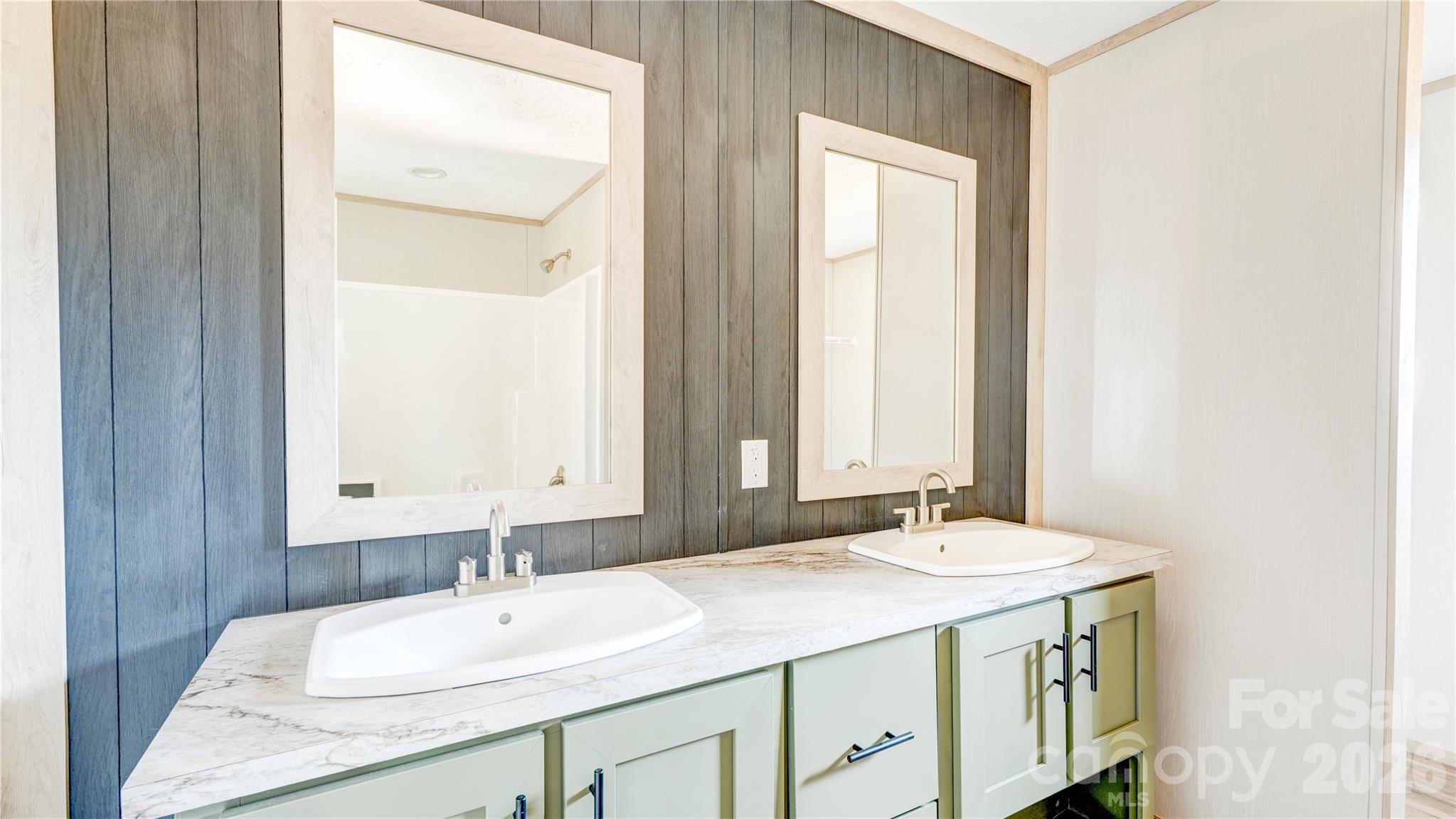 516 Lake Mullis Road Harmony, NC 28634 - Photo 13 of 28 a bathroom with a granite countertop sink and a mirror