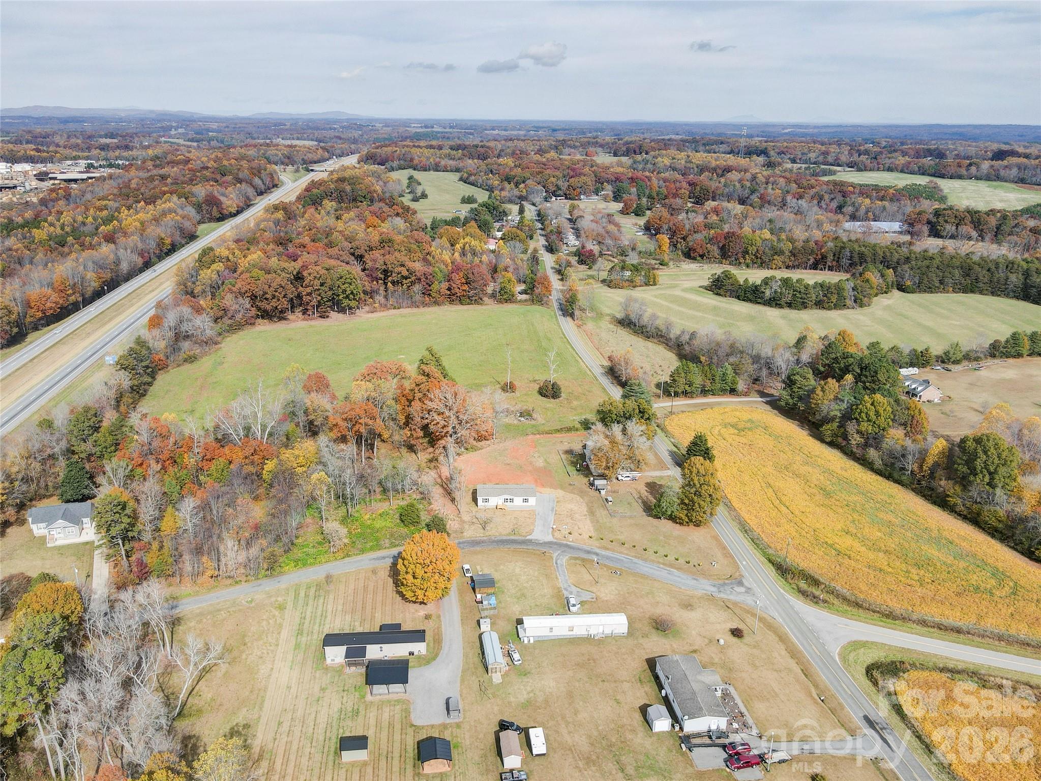 516 Lake Mullis Road Harmony, NC 28634 - Photo 2 of 28 an aerial view of a house with a outdoor space