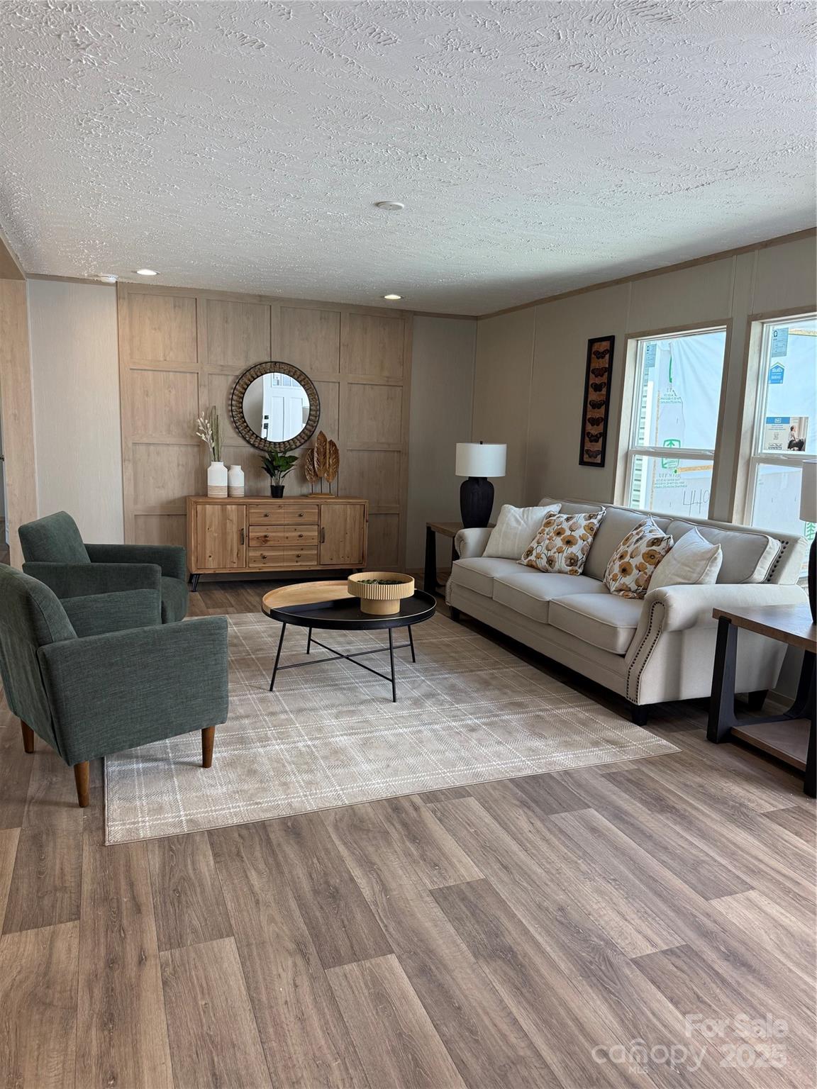 516 Lake Mullis Road Harmony, NC 28634 - Photo 2 of 28 a living room with furniture and a large window