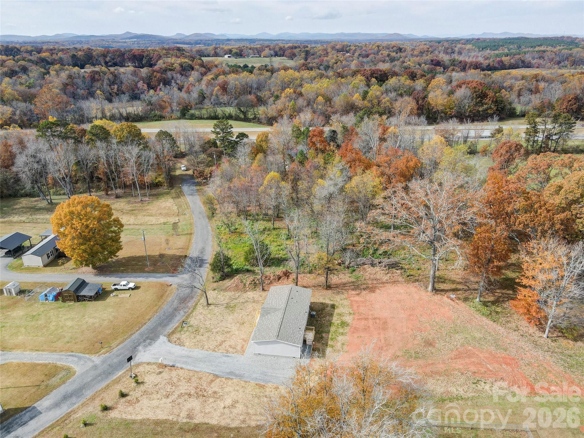 516 Lake Mullis Road Harmony, NC 28634 - Photo 21 of 28 an aerial view of a house with a yard