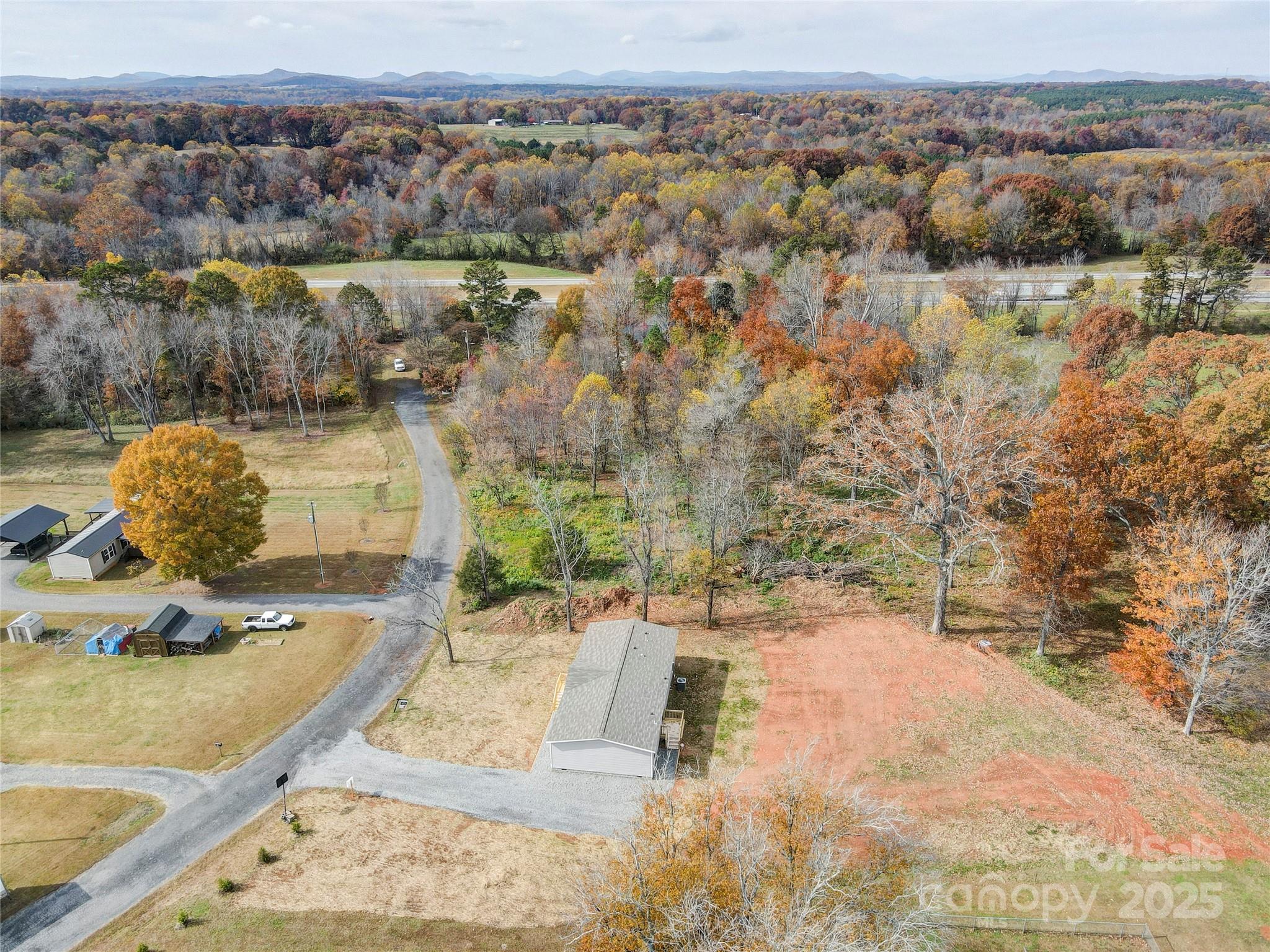 516 Lake Mullis Road Harmony, NC 28634 - Photo 21 of 28 an aerial view of a house with a yard