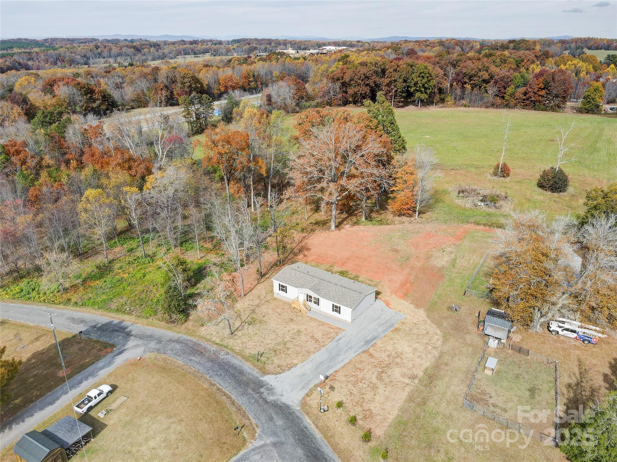 516 Lake Mullis Road Harmony, NC 28634 - Photo 22 of 28 an aerial view of a house with a yard