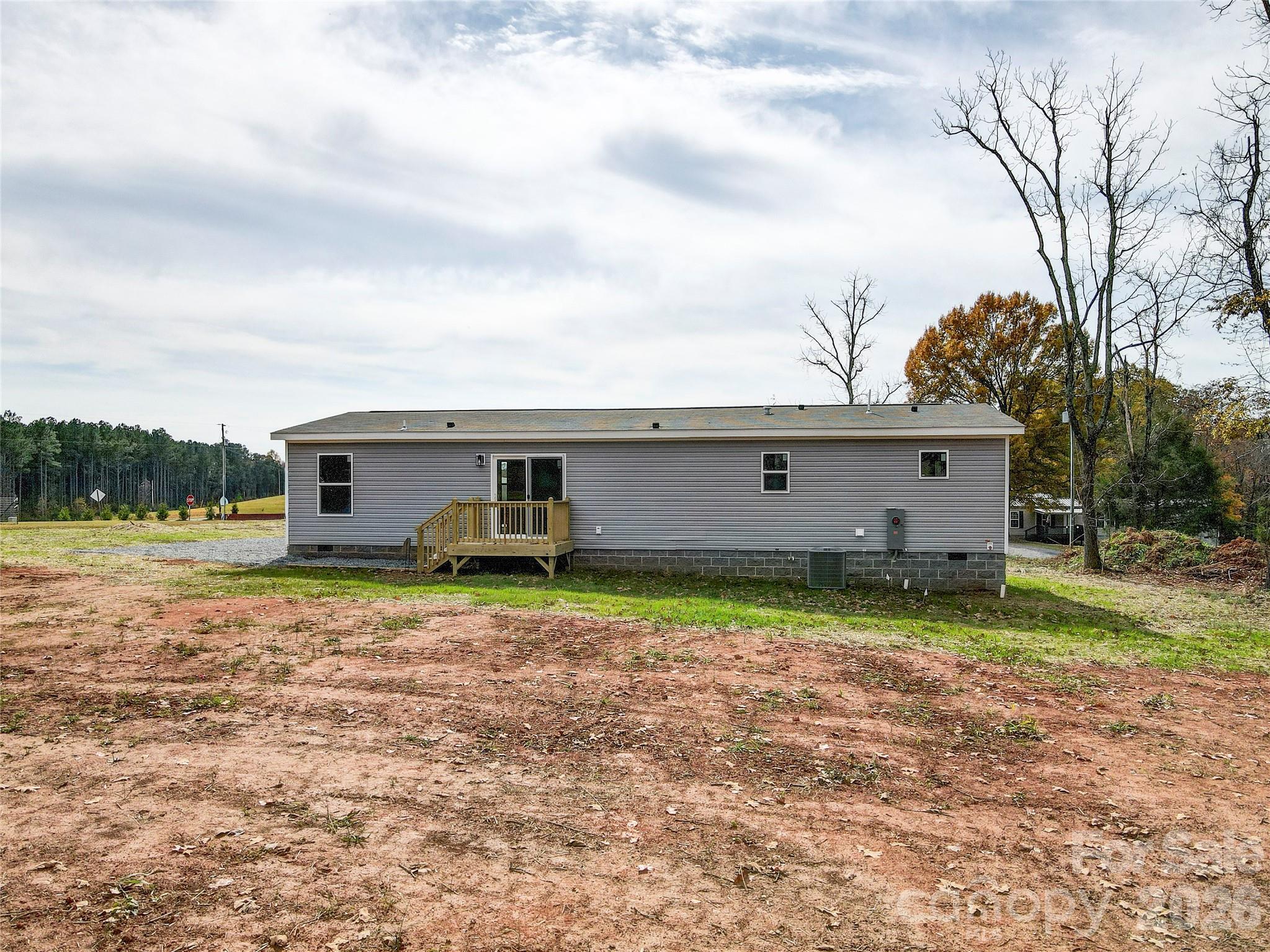 516 Lake Mullis Road Harmony, NC 28634 - Photo 25 of 28 front view of a house with a yard