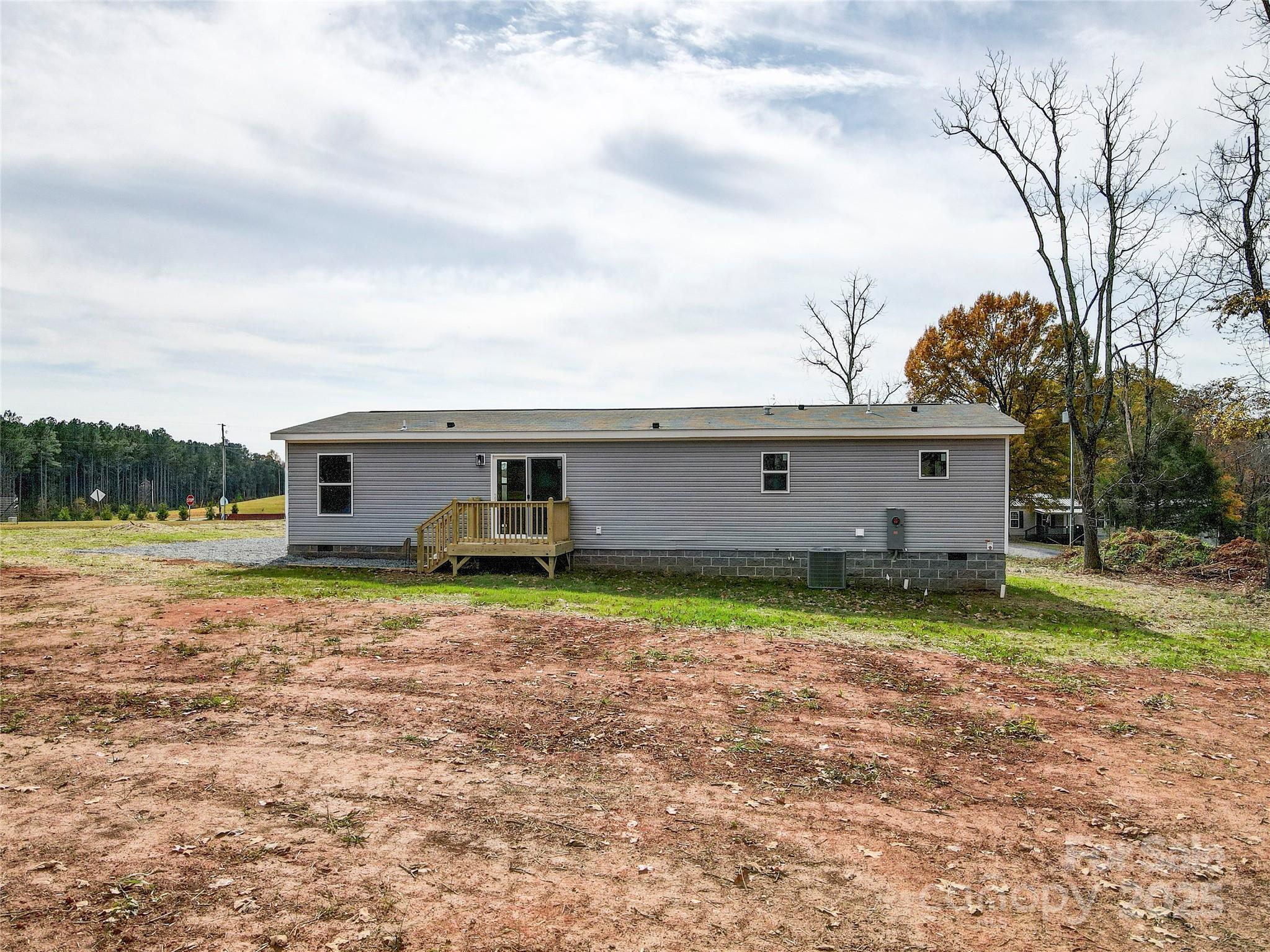 516 Lake Mullis Road Harmony, NC 28634 - Photo 25 of 28 front view of a house with a yard
