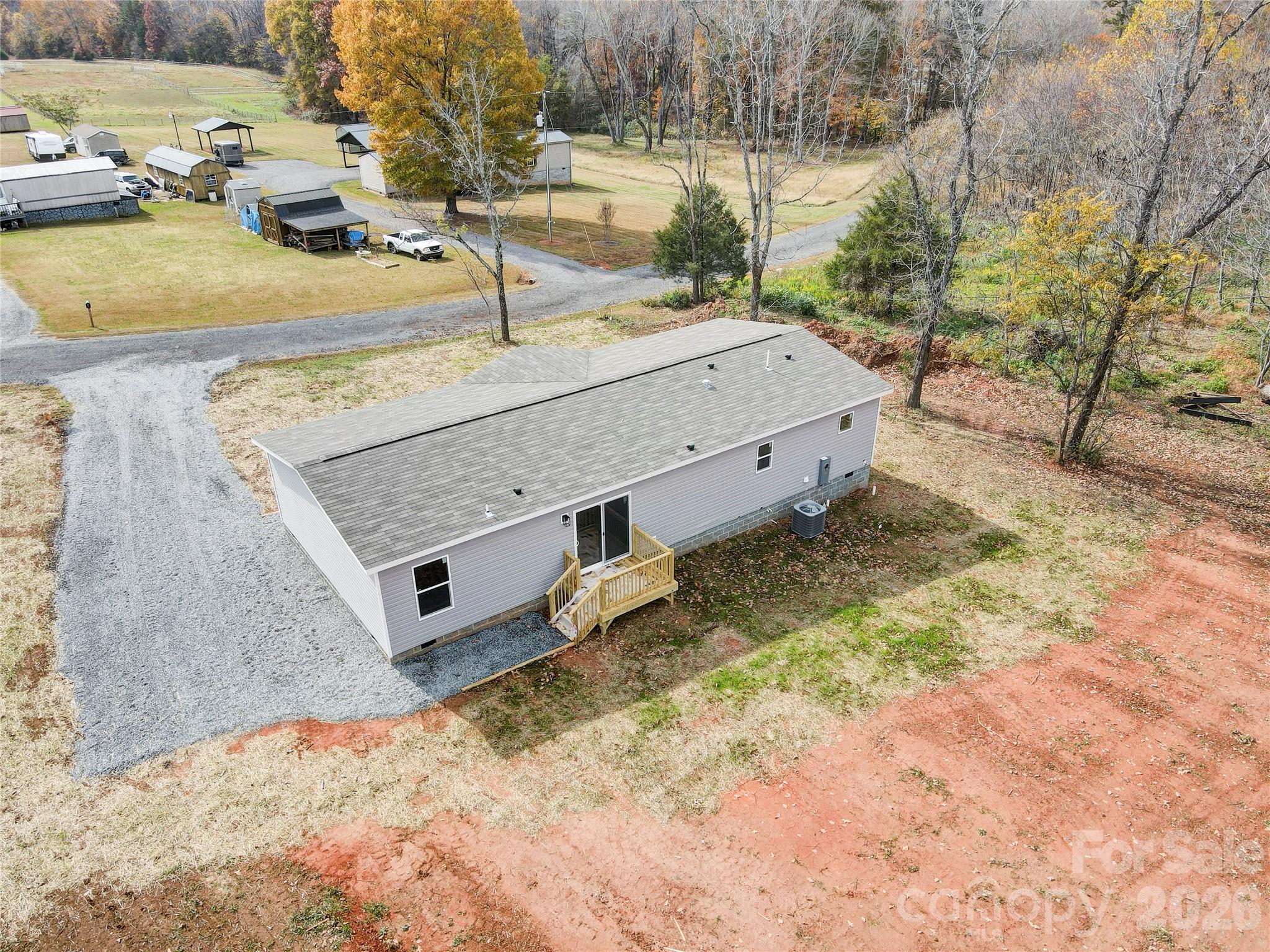 516 Lake Mullis Road Harmony, NC 28634 - Photo 27 of 28 a view of a backyard with a tub