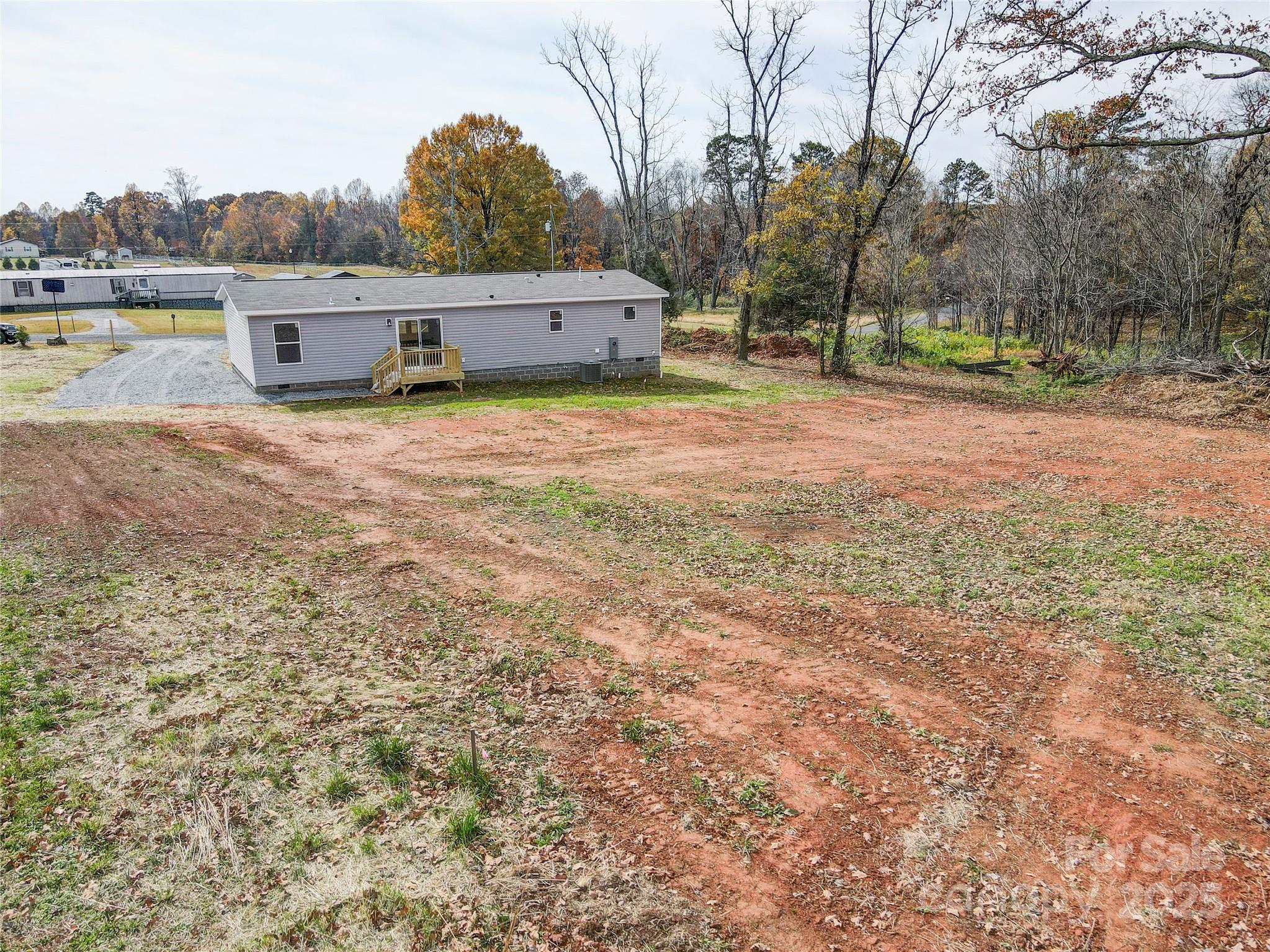 516 Lake Mullis Road Harmony, NC 28634 - Photo 28 of 28 a view of a house with yard and sitting area