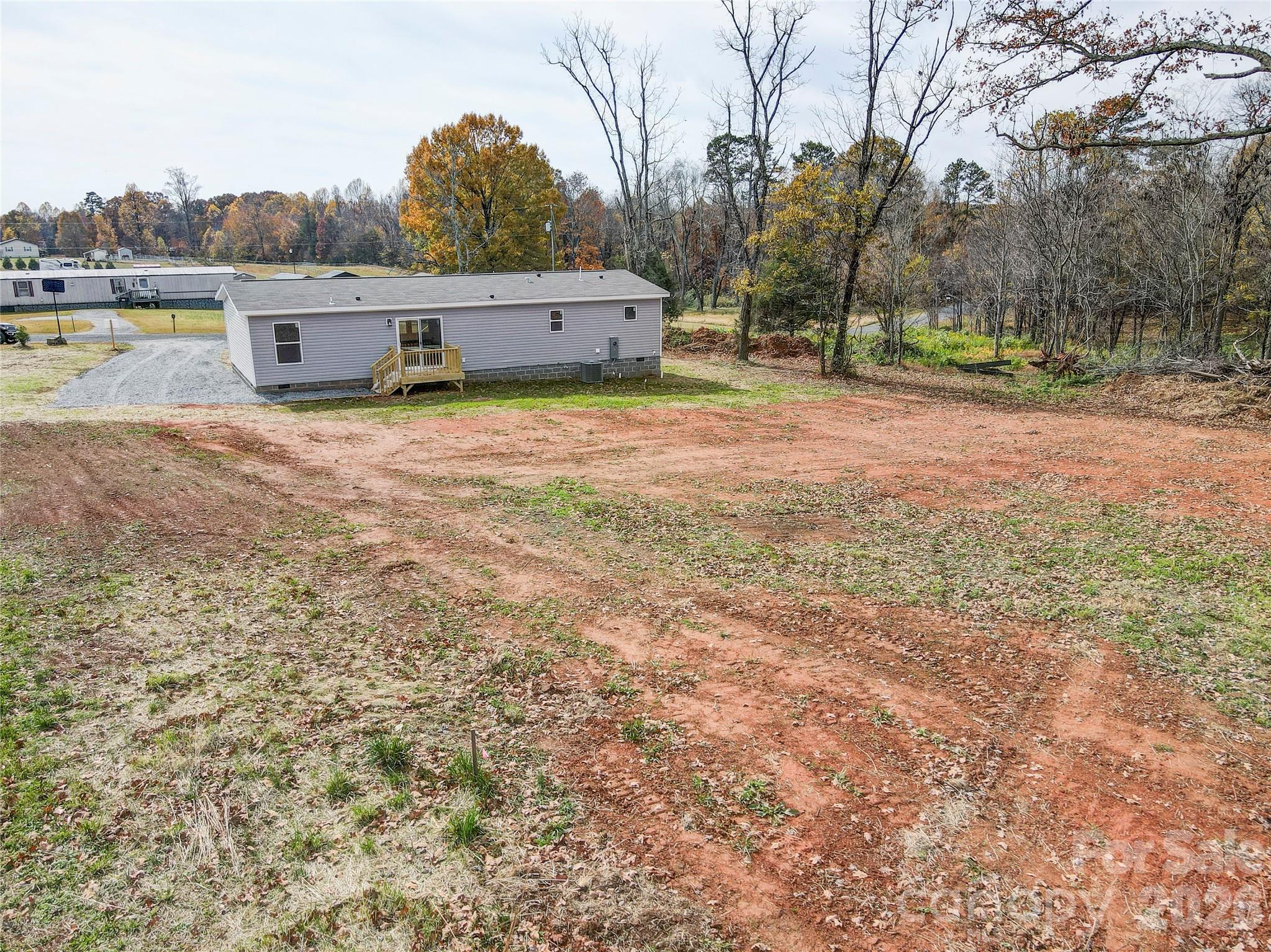 516 Lake Mullis Road Harmony, NC 28634 - Photo 28 of 28 a view of a house with yard and sitting area