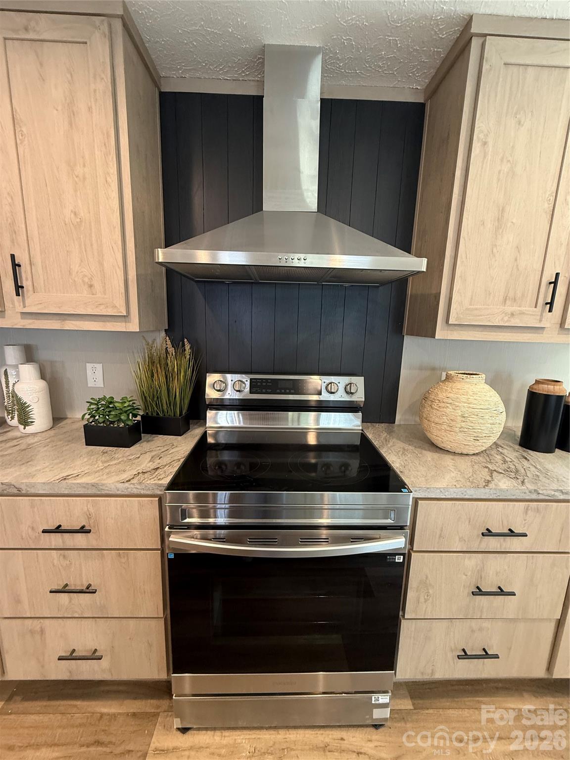 516 Lake Mullis Road Harmony, NC 28634 - Photo 6 of 28 a stove top oven sitting inside of a kitchen