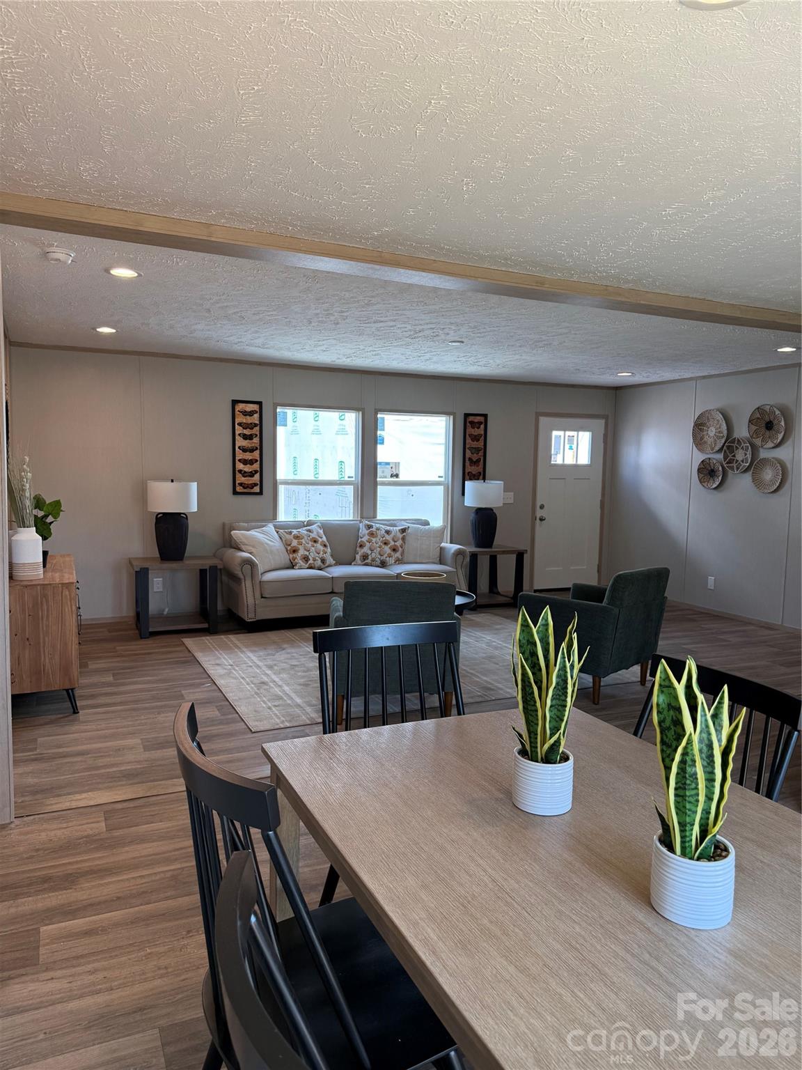 516 Lake Mullis Road Harmony, NC 28634 - Photo 8 of 28 a dining room with furniture and potted plants