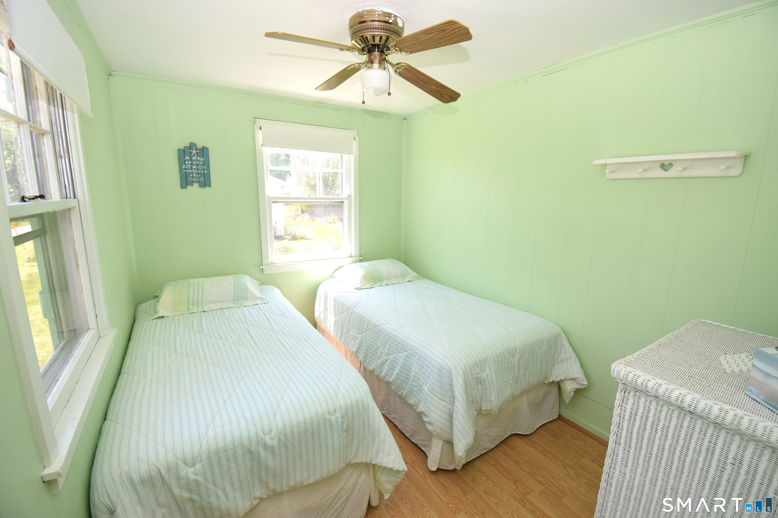 50 East Street Madison, CT 06443 - Photo 14 of 26 a bedroom with a bed and a chandelier