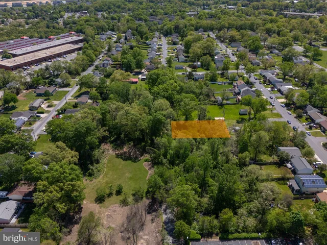 an aerial view of residential house with outdoor space and swimming pool