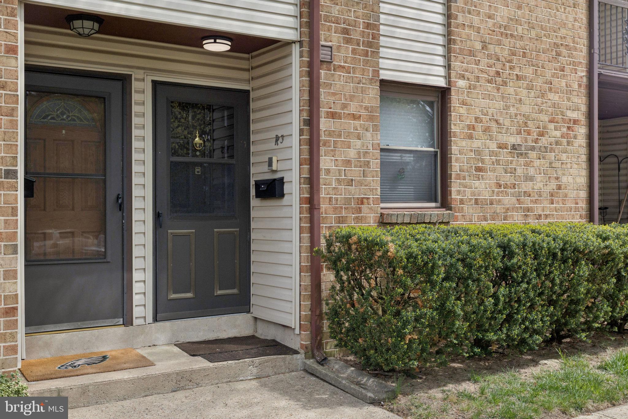 1475 Mt Holly Road, Unit R3 Edgewater Park, NJ 08010 - Photo 2 of 19 a front view of a house with a garden