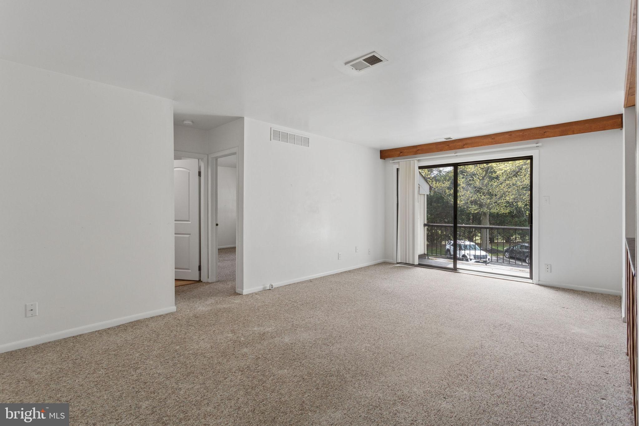1475 Mt Holly Road, Unit R3 Edgewater Park, NJ 08010 - Photo 5 of 19 a view of an empty room with glass door and balcony