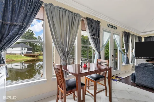 a dining room with furniture and window