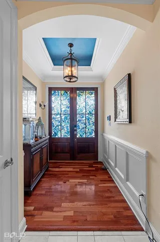 a living room with stainless steel appliances granite countertop a stove top oven a sink with granite countertops and cabinets