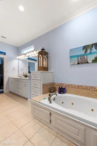 a bathroom with a bathtub and a sink