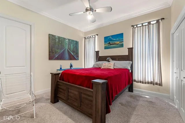 a spacious bedroom with a bed and a window