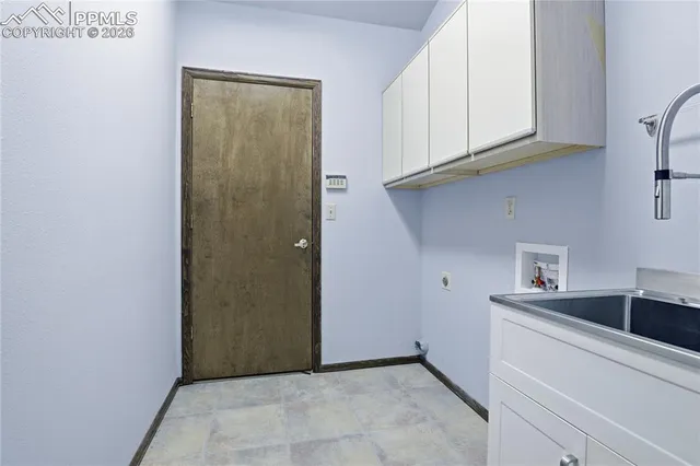 a view of cabinets and wooden floor