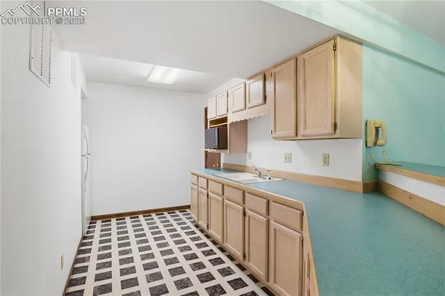 a kitchen with stainless steel appliances a sink and cabinets