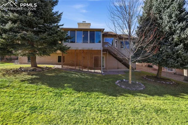 a view of a house with a yard