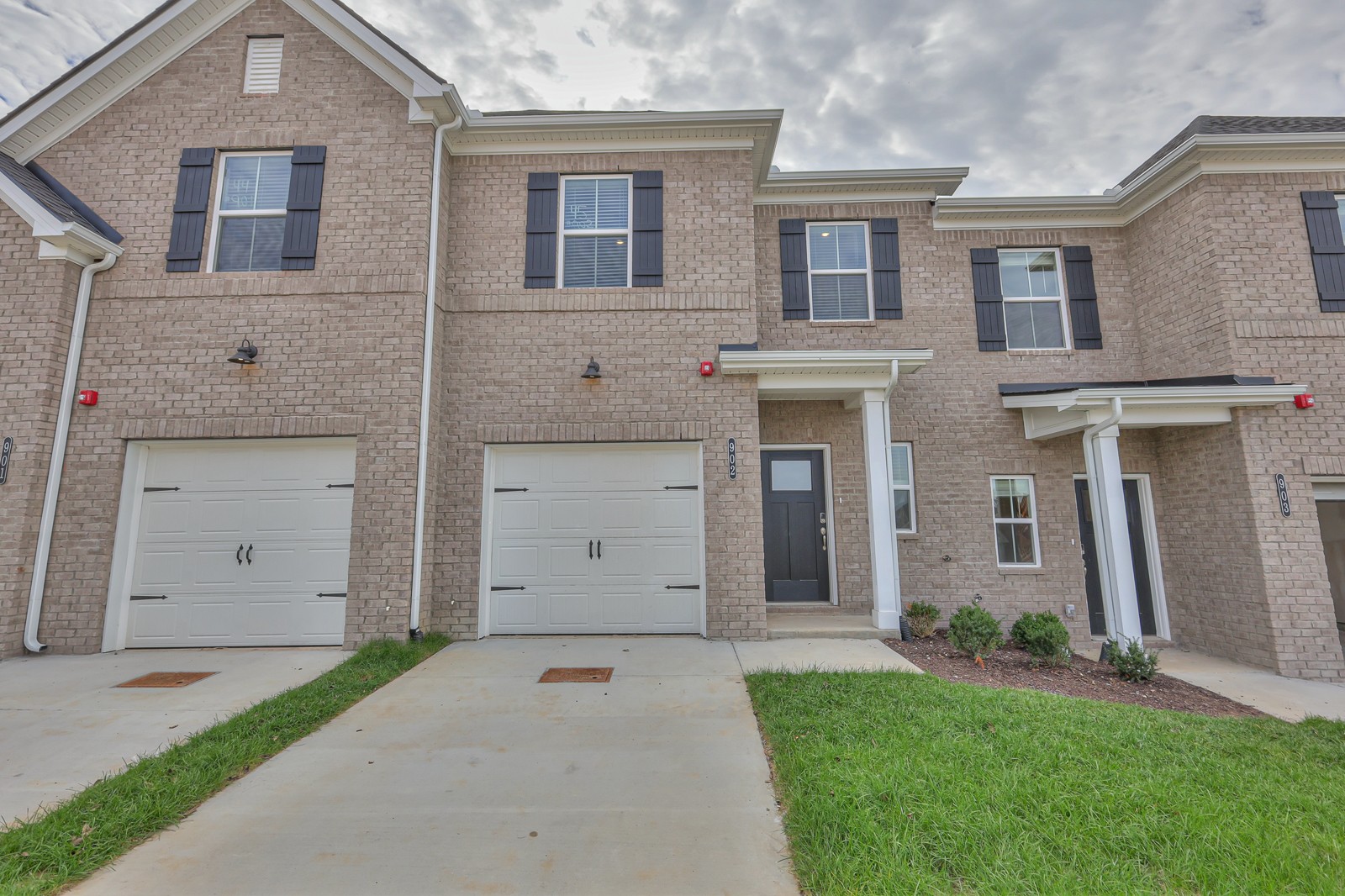 204 Douglas Bend Road, Unit 902 Gallatin, TN 37066 - Photo 1 of 32 front view of a house with a yard and a garage