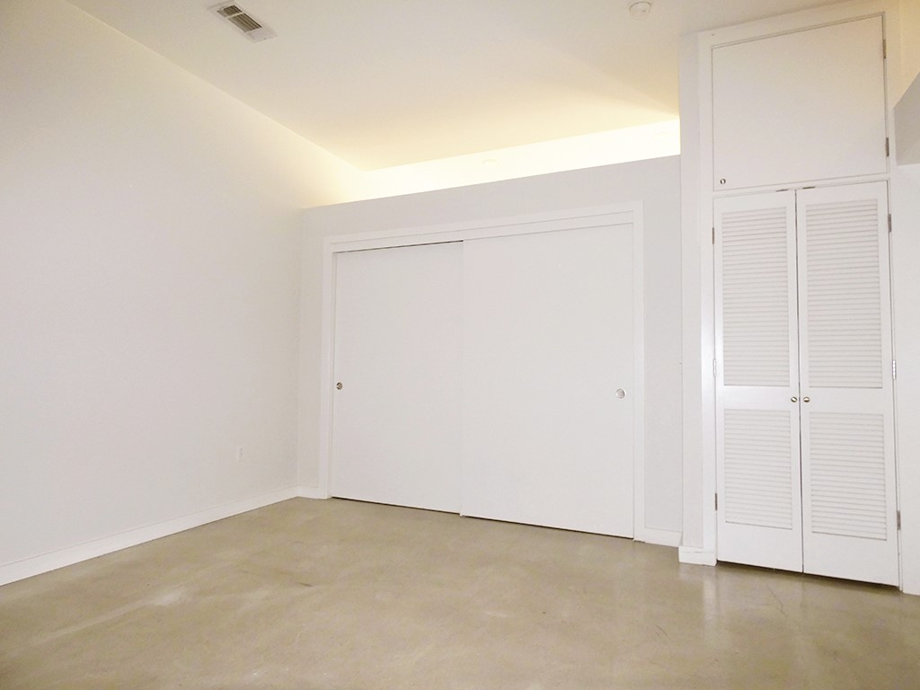 507 Sabine Street, Unit 704 Austin, TX 78701 - Photo 10 of 19 Loft-Space above Closet can be used for storage such as a small library of books. Full-sized stackable Washer/Dryer in Utility Closet to right.