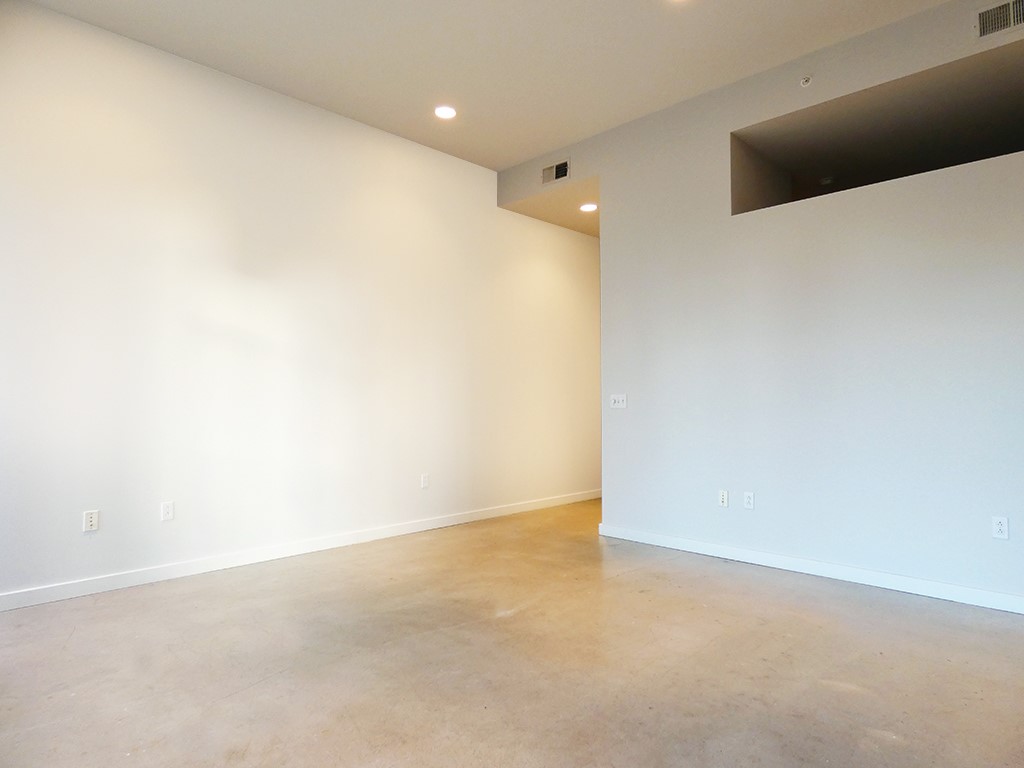 507 Sabine Street, Unit 704 Austin, TX 78701 - Photo 5 of 19 12ft Ceilings in Living Room and Kitchen area give it a larger-than-life-feel.