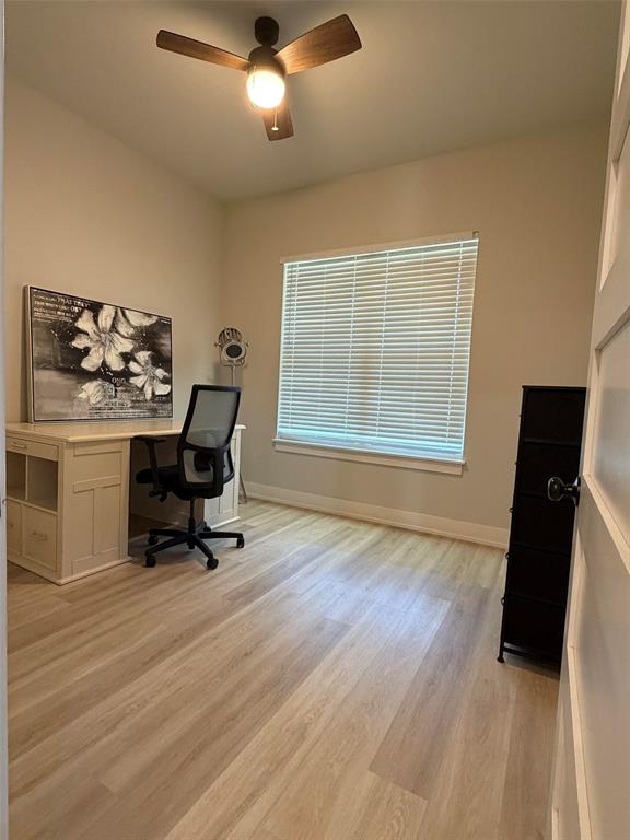 151 Gopher Road Weatherford, TX 76088 - Photo 17 of 22 a view of a workspace with furniture and a window